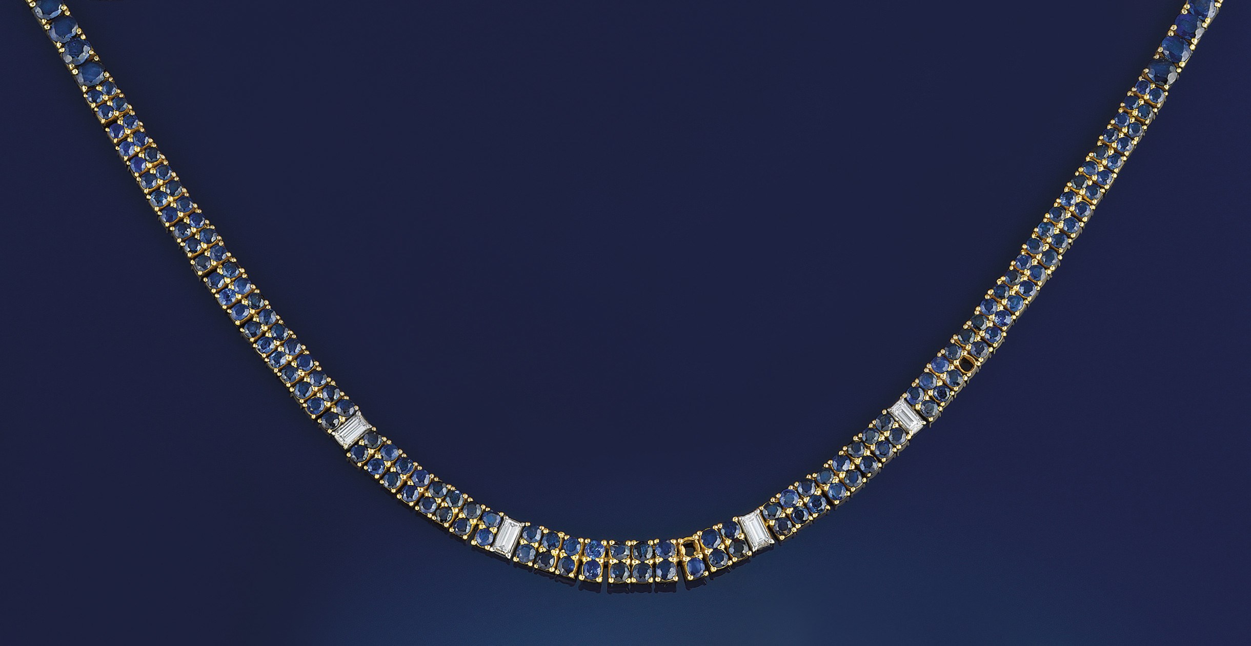 A sapphire, diamond and emerald necklace