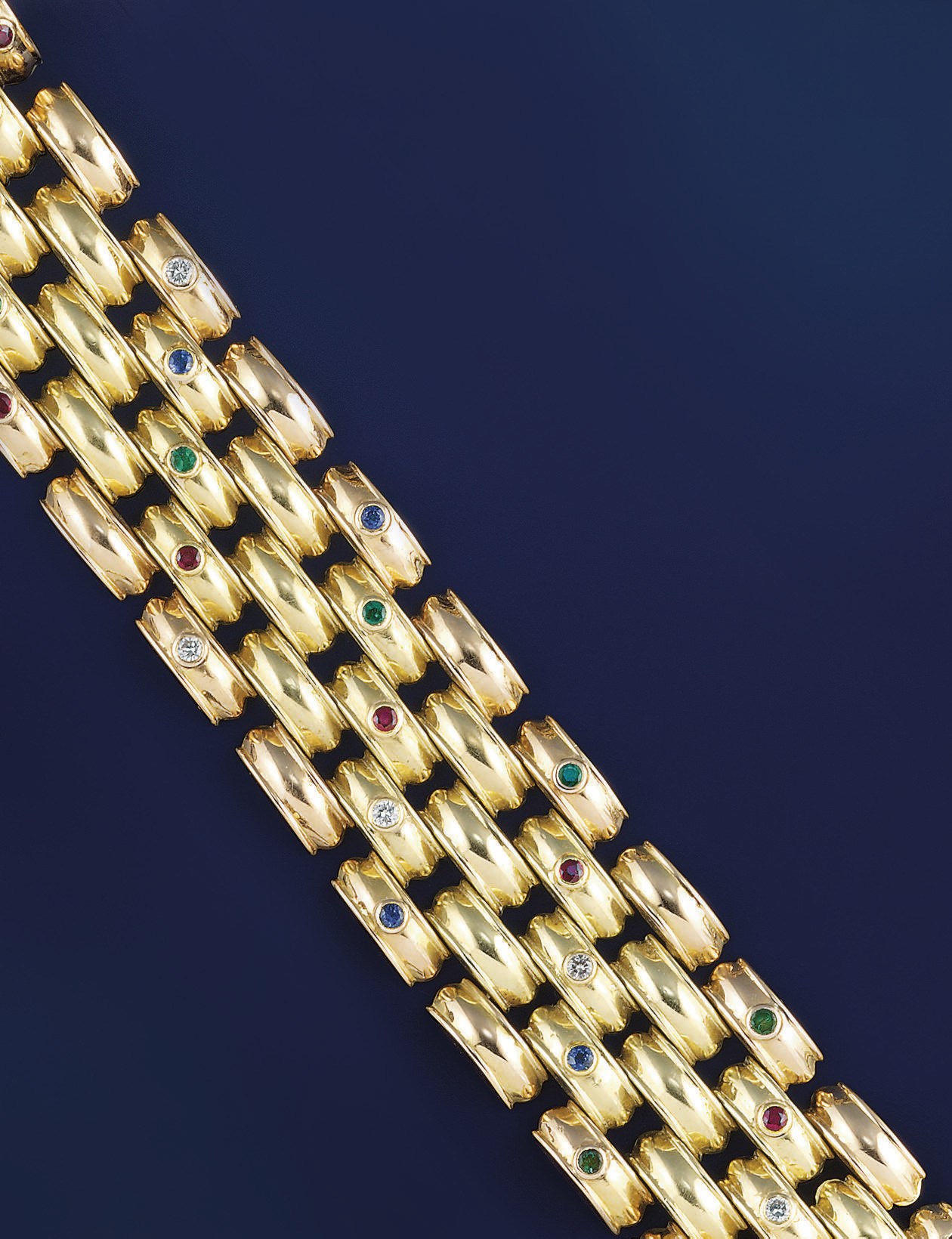 A diamond and gem-set two colour bracelet