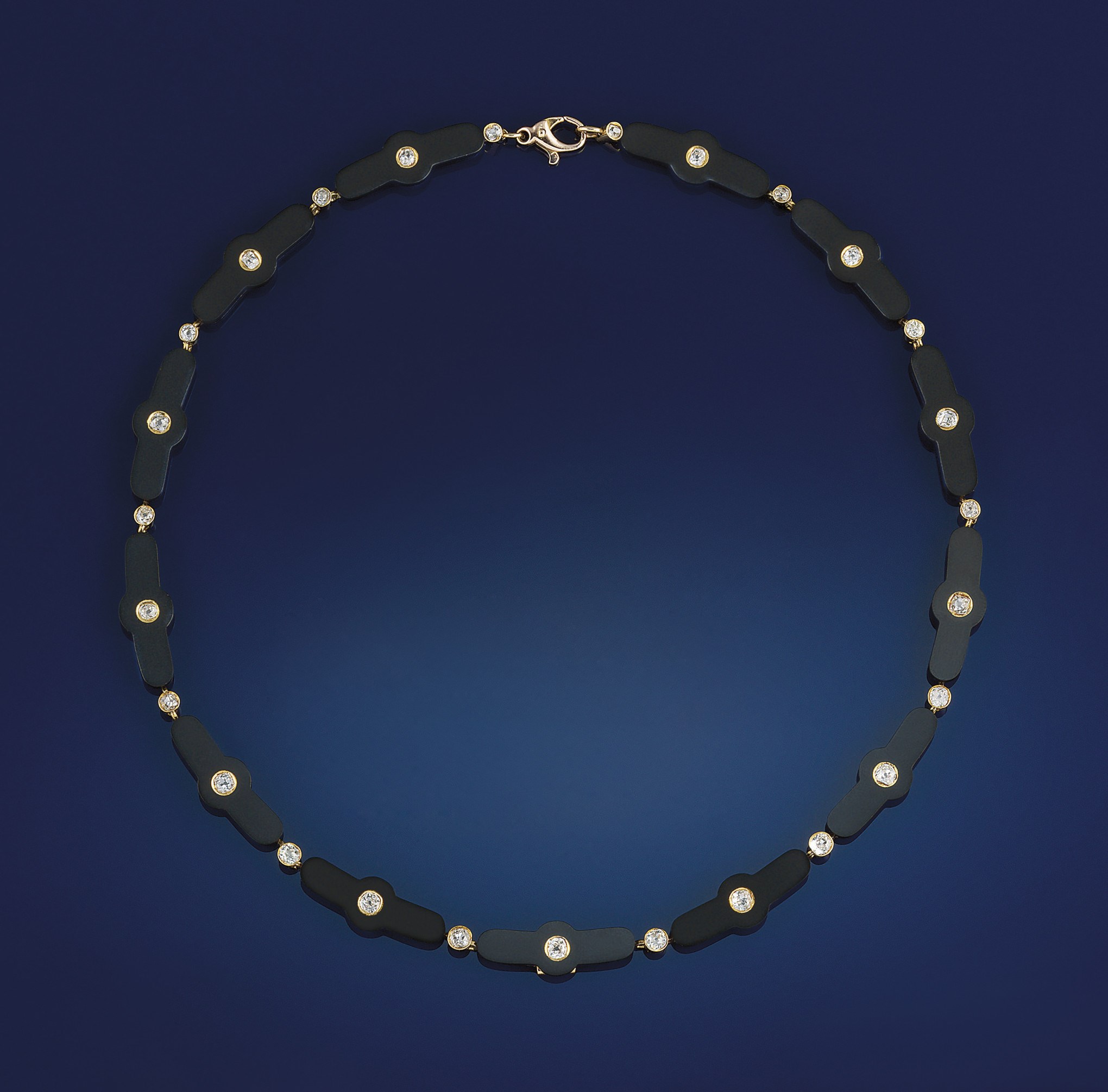 A late 19th/early 20th gold, onyx and diamond necklace