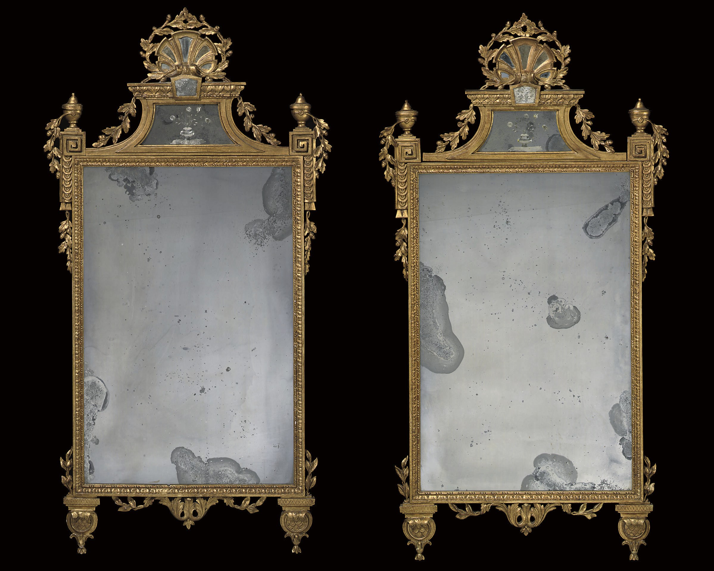 A PAIR OF NORTH ITALIAN GILTWOOD MIRRORS