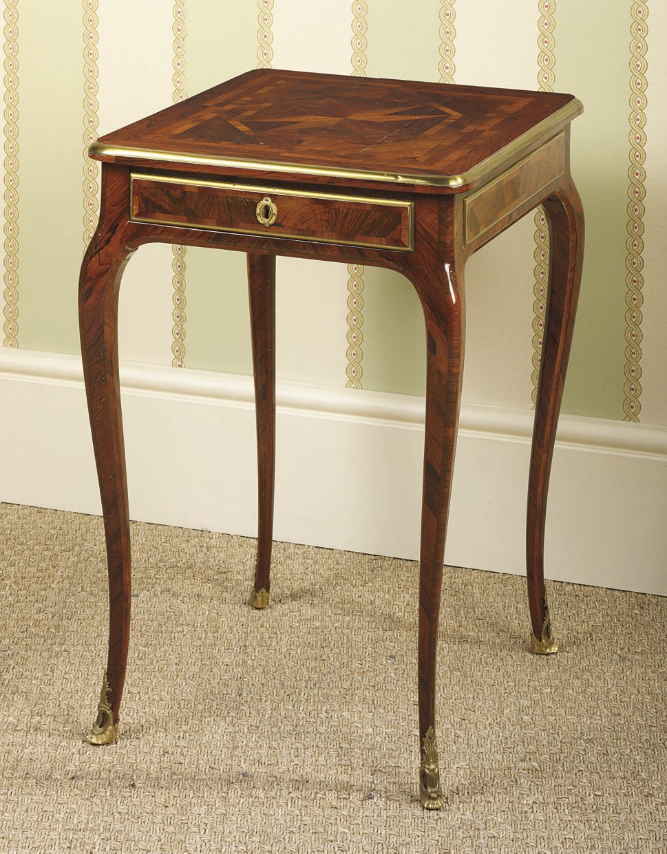A NORTH EUROPEAN BRASS-BANDED ROSEWOOD, KINGWOOD AND BOIS SATINE PARQUETRY OCCASIONAL TABLE