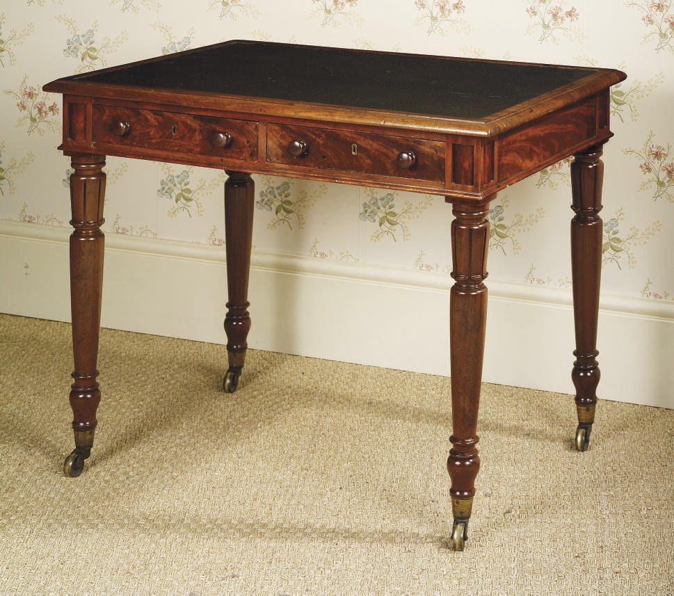 A GEORGE IV MAHOGANY WRITING-TABLE
