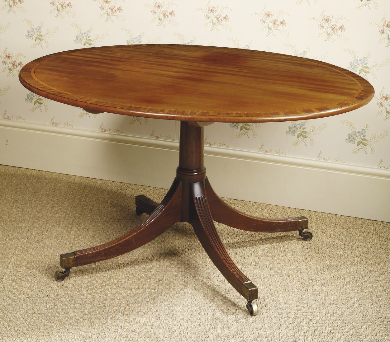 A GEORGE III MAHOGANY BREAKFAST TABLE