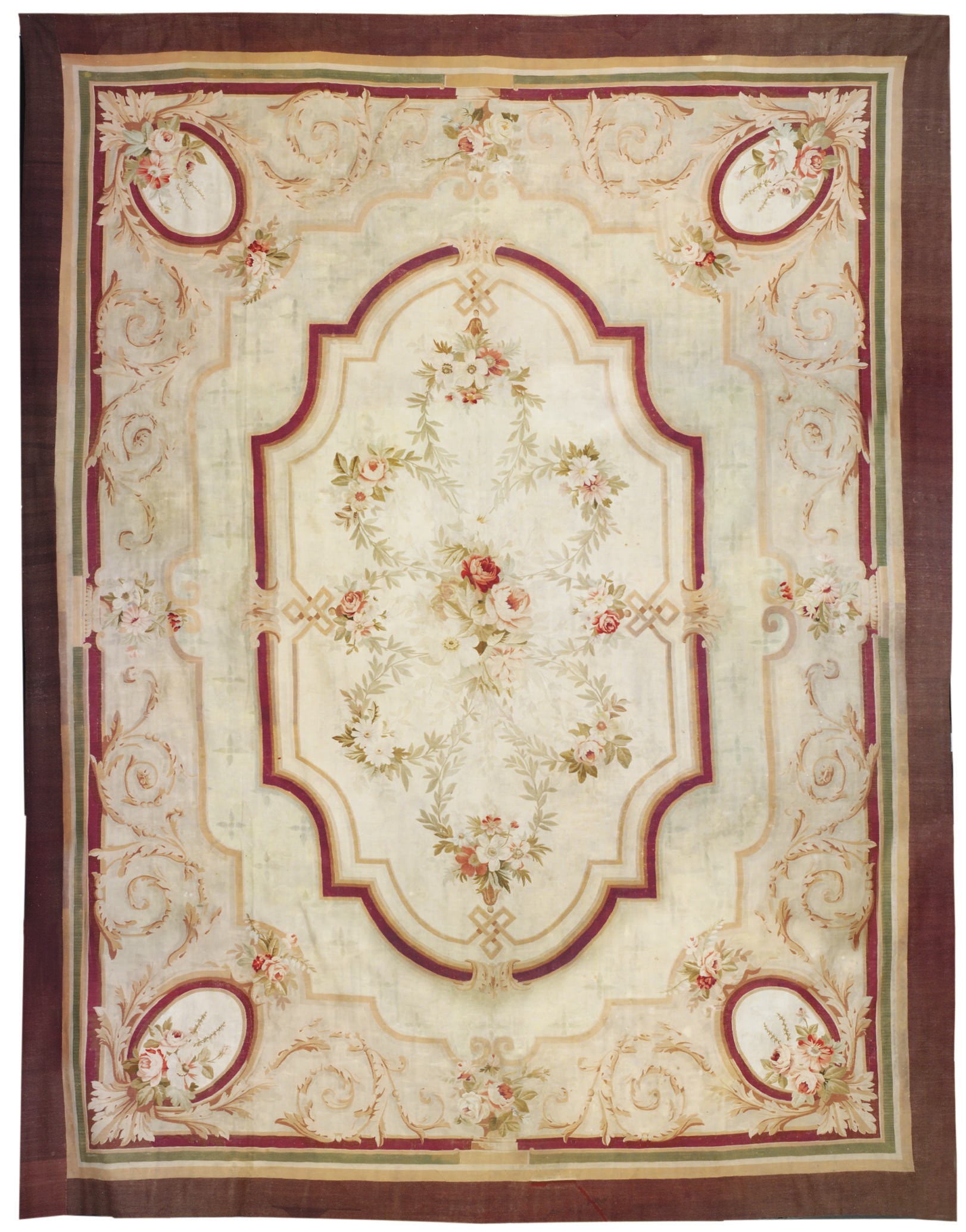 A LARGE AUBUSSON CARPET