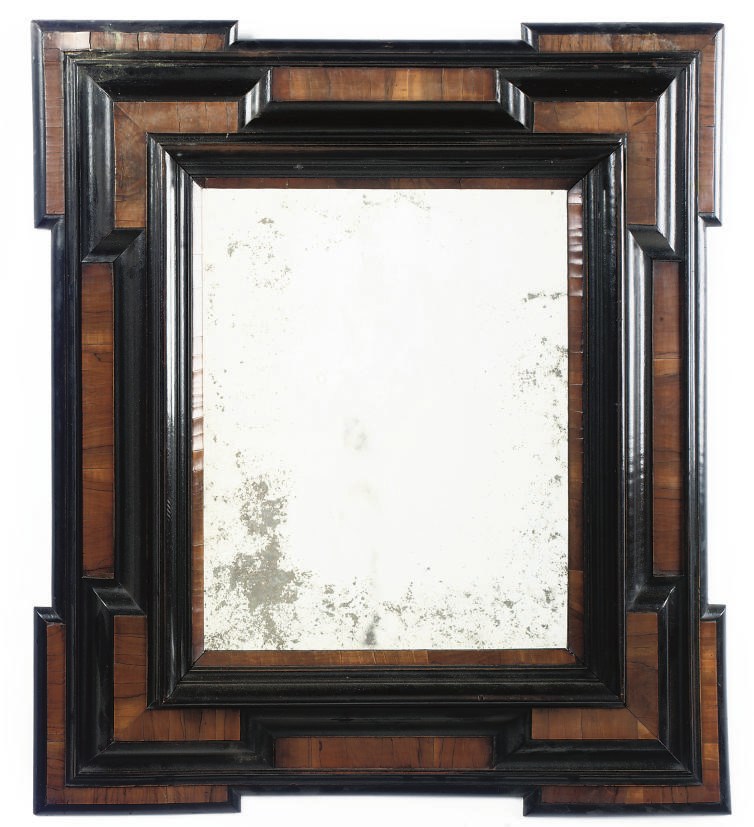 A FLEMISH WALNUT AND EBONISED MIRROR
