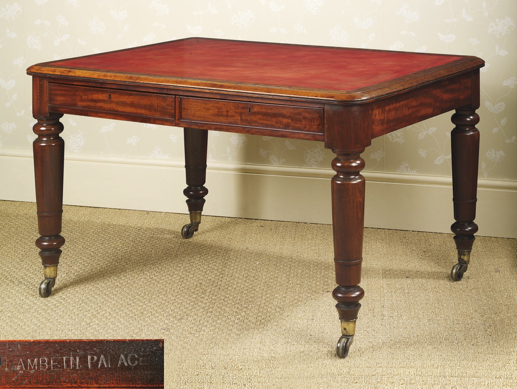 AN EARLY VICTORIAN MAHOGANY WRITING-TABLE