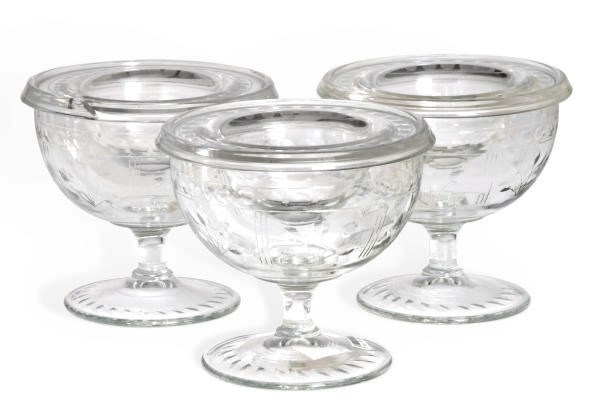 A SET OF TWELVE AMERICAN GLASS FOOTED CAVIAR DISHES,