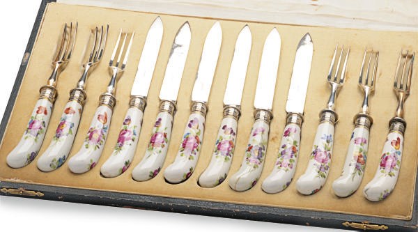 AN ENGLISH SILVER-PLATED FRUIT SERVICE FOR SIX WITH ENGLISH PORCELAIN PISTOL-FORM HANDLES,