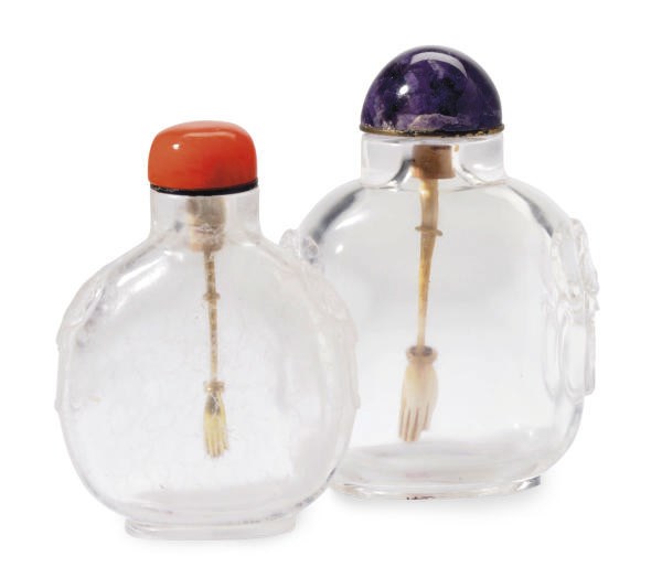 A CHINESE CARVED ROCK CRYSTAL SNUFF BOTTLE AND A CARVED SEASPRAY CRYSTAL SNUFF BOTTLE,**