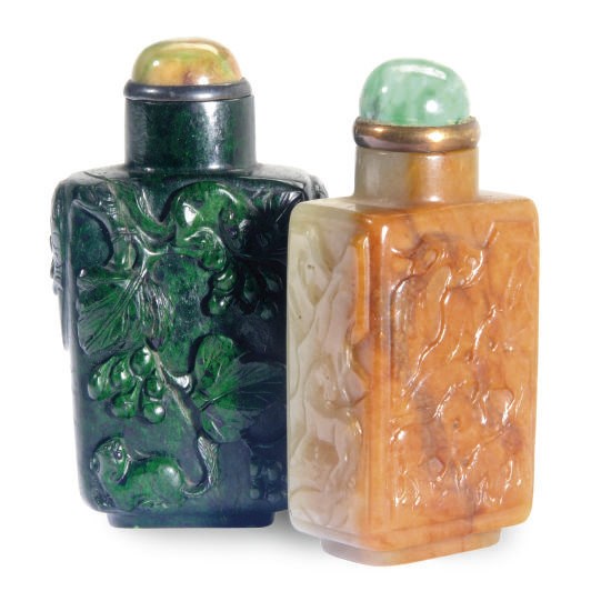 TWO CHINESE RUSSET AND GREYISH-WHITE JADE SNUFF BOTTLE AND A CARVED CHLOROMELANITE SNUFF BOTTLE,