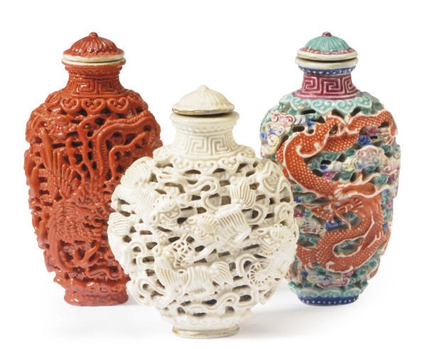 THREE CHINESE MOLDED PORCELAIN SNUFF BOTTLES AND STOPPERS,**