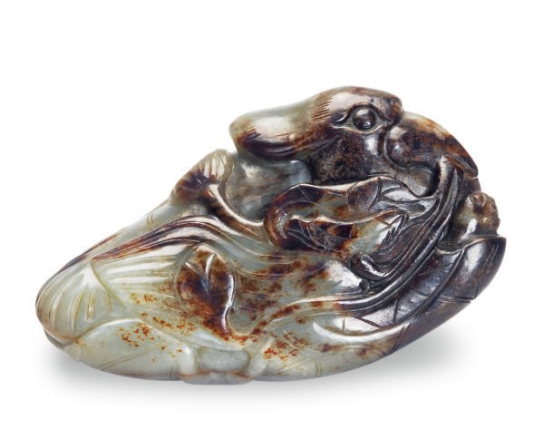 A GREY AND BROWN CHINESE JADE FIGURE OF A RECUMBENT MANDARIN DUCK,