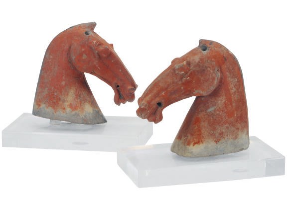 A PAIR OF CHINESE PAINTED POTTERY MODELS OF HORSE HEADS,