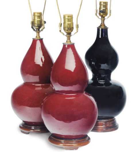A PAIR OF CHINESE PORCELAIN COPPER RED-GLAZED DOUBLE GOURD VASES AND A BLACK-GLAZED DOUBLE GOURD VASE, EACH MOUNTED AS A LAMP,