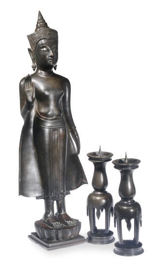 A THAI STANDING BUDDHA AND A PAIR OF JAPANESE BRONZE TAPER STICKS,
