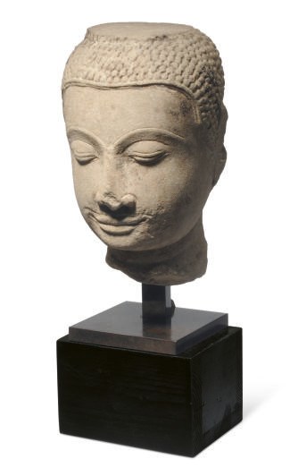 A THAI SANDSTONE HEAD OF A BUDDHA,