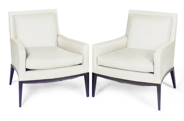 A PAIR OF EBONIZED AND UPHOLSTERED ARMCHAIRS,