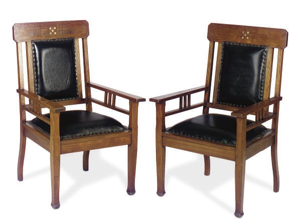 A PAIR OF WALNUT AND BLACK LEATHER UPHOLSTERED ARMCHAIRS,