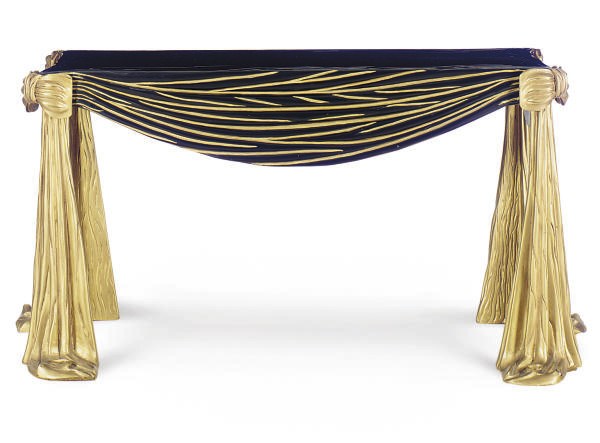 AN EBONIZED AND PARCEL-GILT 'DRAPED' CONSOLE TABLE,
