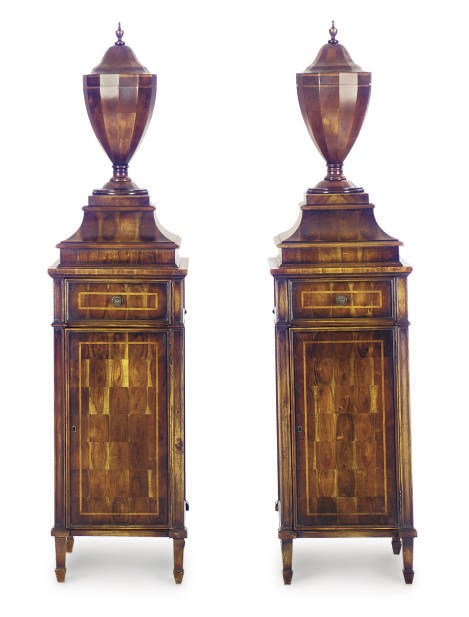 A PAIR OF WALNUT COVERED URNS-ON-PEDESTALS,