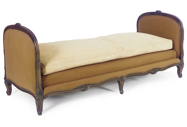 A BEECHWOOD AND UPHOLSTERED DAYBED,
