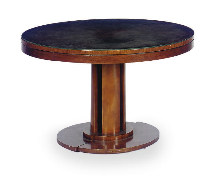 A MAHOGANY EXTENDING CIRCULAR DINING TABLE,