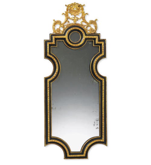 A CENTRAL EUROPEAN GILTWOOD AND EBONIZED MIRROR