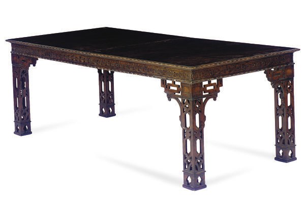 A MAHOGANY EXTENDING DINING TABLE,