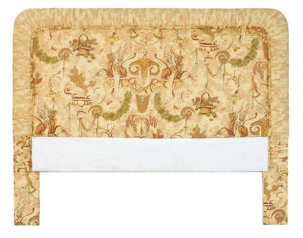 AN UPHOLSTERED HEADBOARD,