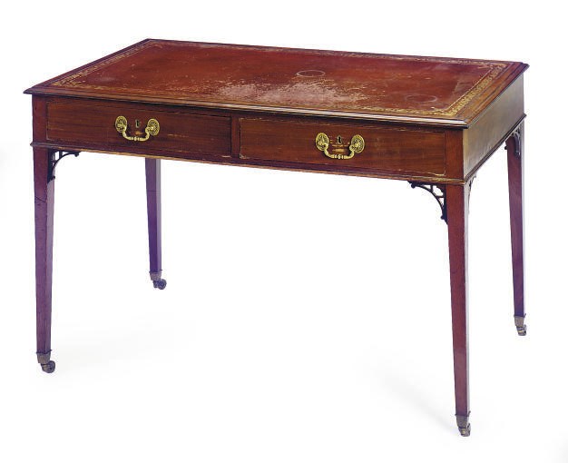 AN ENGLISH MAHOGANY WRITING TABLE,