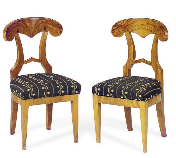 A SET OF FOUR BIEDERMEIER WALNUT SIDE CHAIRS,