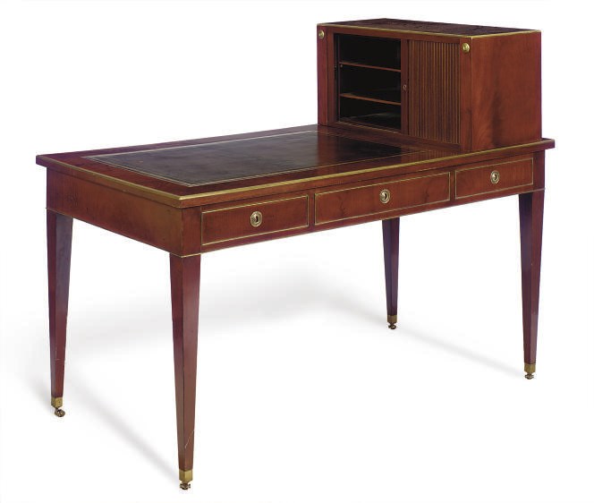 A NORTH EUROPEAN BRASS-MOUNTED MAHOGANY BUREAU PLAT EN CARTONIER,