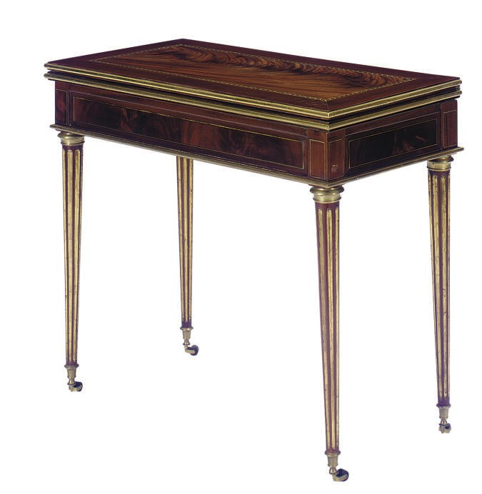A BALTIC ORMOLU-MOUNTED MAHOGANY AND PARCEL-GILT GAMES TABLE,