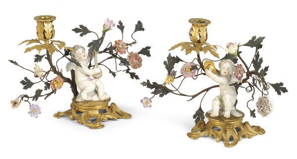A PAIR OF GILT-BRONZE, ENAMELED METAL AND PORCELAIN FIGURAL CANDLESTICKS,