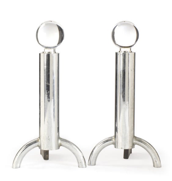 A PAIR OF CHROMED METAL AND GLASS ANDIRONS,