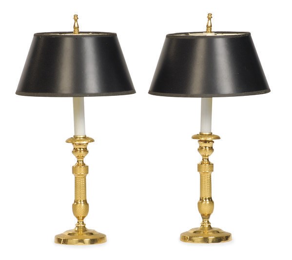 A PAIR OF GILT-METAL CANDLESTICKS MOUNTED AS LAMPS,