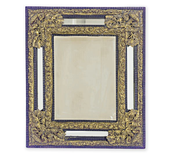A GILT-METAL MOUNTED EBONIZED MIRROR,