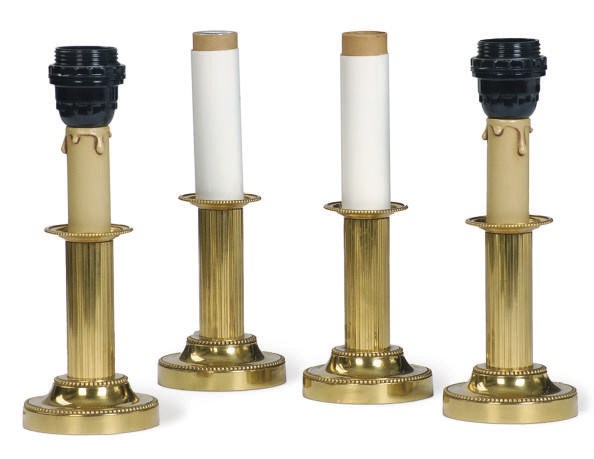 A SET OF FOUR GILT-METAL CANDLESTICKS MOUNTED AS LAMPS,