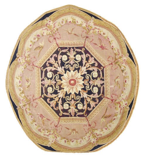 A CIRCULAR AUBUSSON CARPET FRAGMENT,