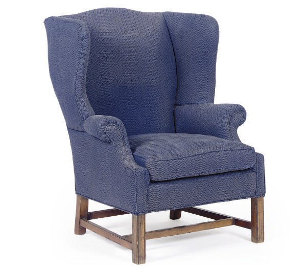 A FRUITWOOD AND UPHOLSTERED WINGBACK ARMCHAIR,