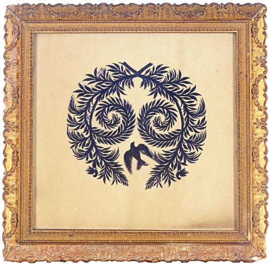 A FRAMED PAPER CUT-OUT,
