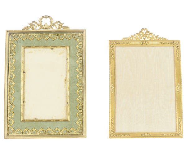 TWO ORMOLU TABLE-TOP PICTURE FRAMES,