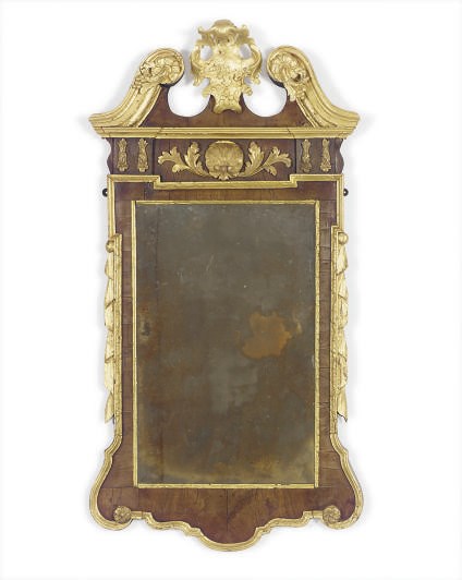 A GEORGE II MAHOGANY AND PARCEL-GILT MIRROR,