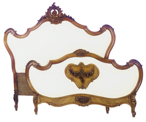 A WALNUT AND UPHOLSTERED BED,
