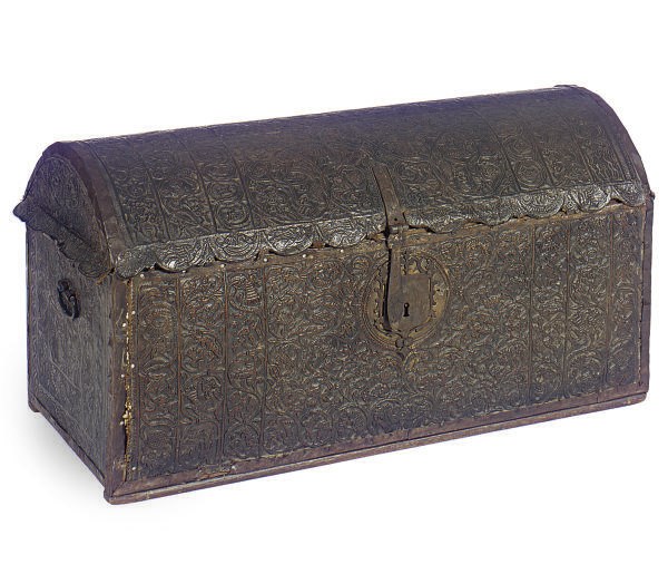 AN EMBOSSED LEATHER COVERED HARDWOOD CHEST,