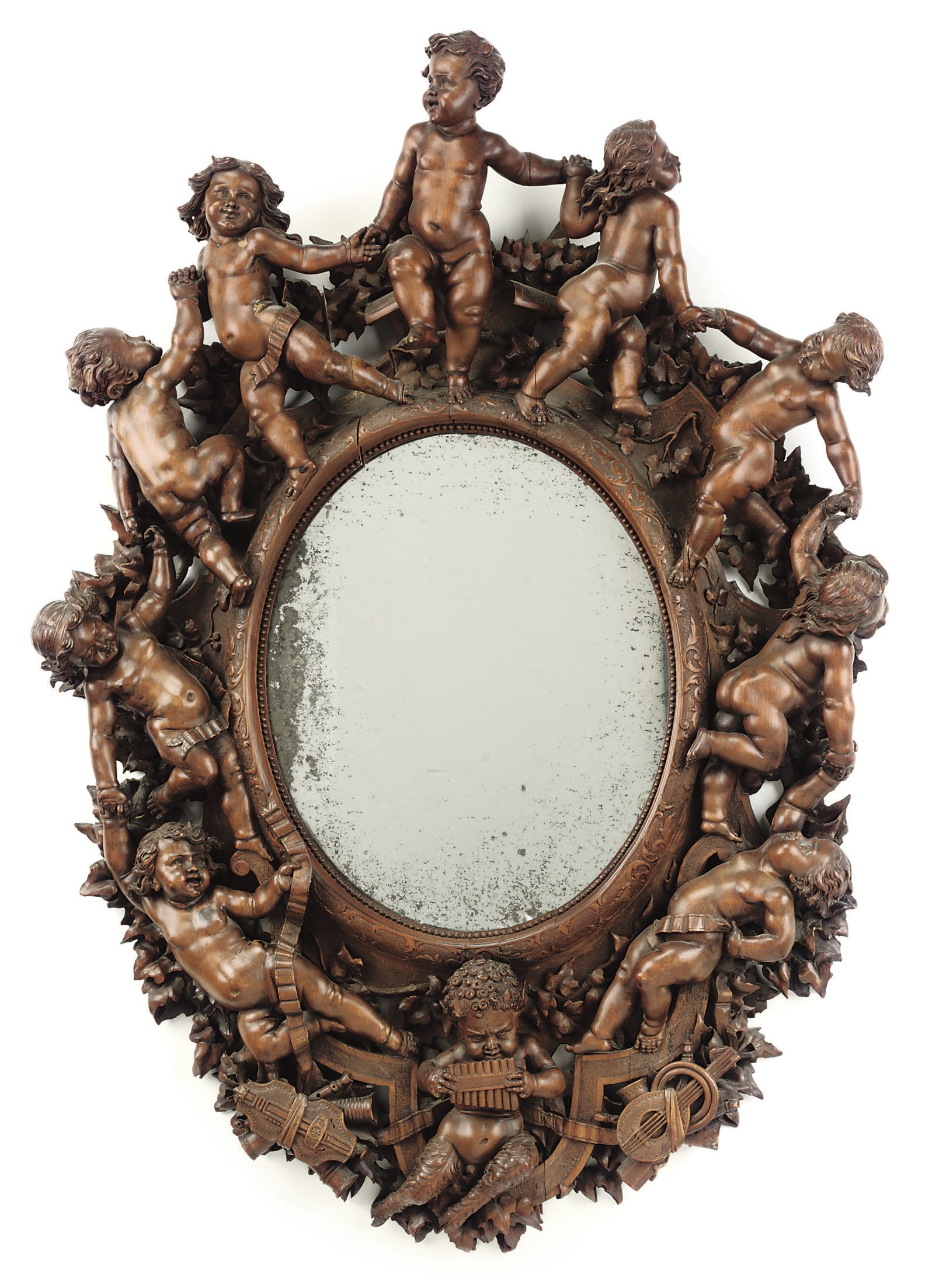 AN ITALIAN CARVED WALNUT MIRROR