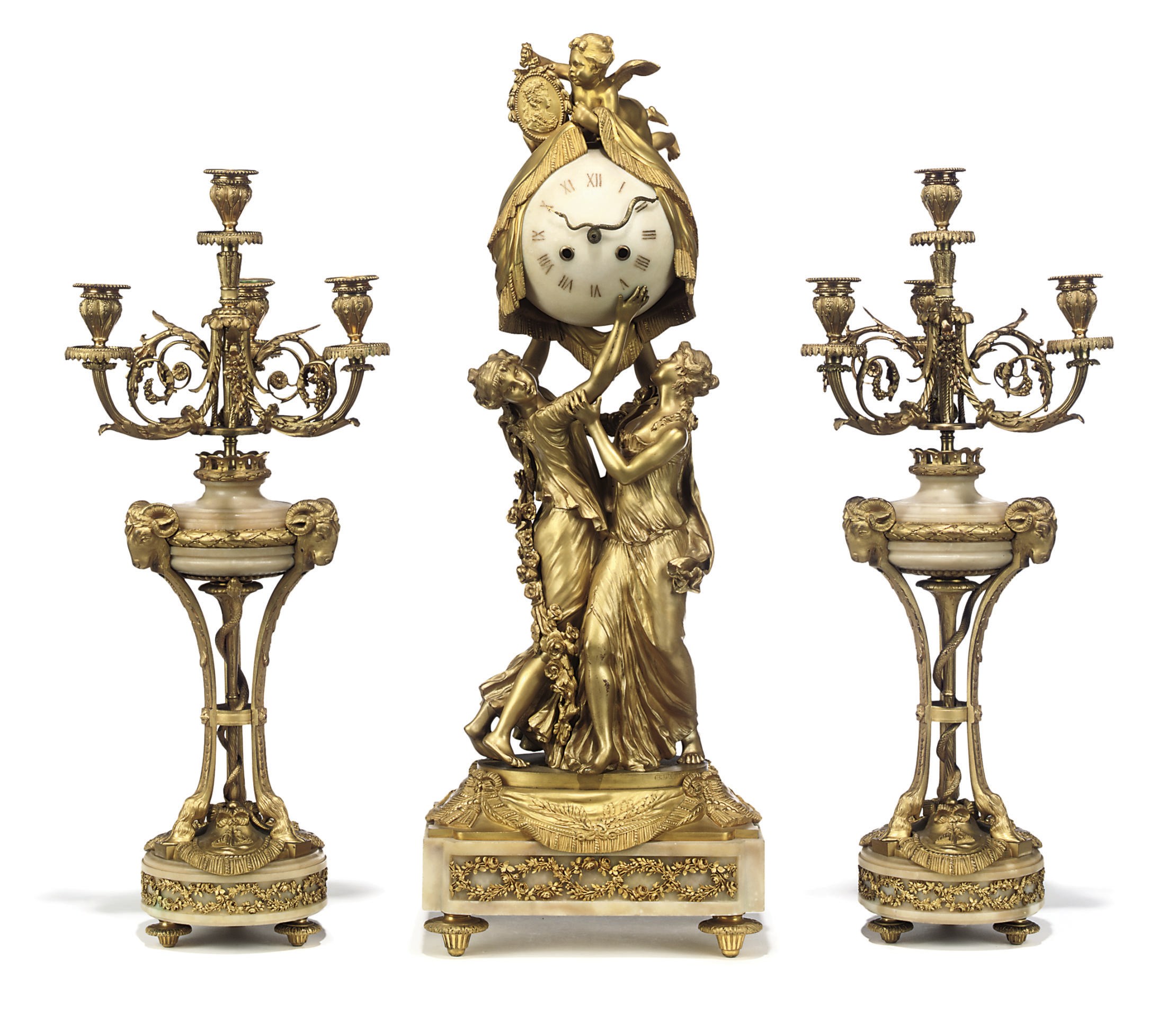 A NAPOLEON III ORMOLU AND WHITE MARBLE THREE-PIECE GARNITURE