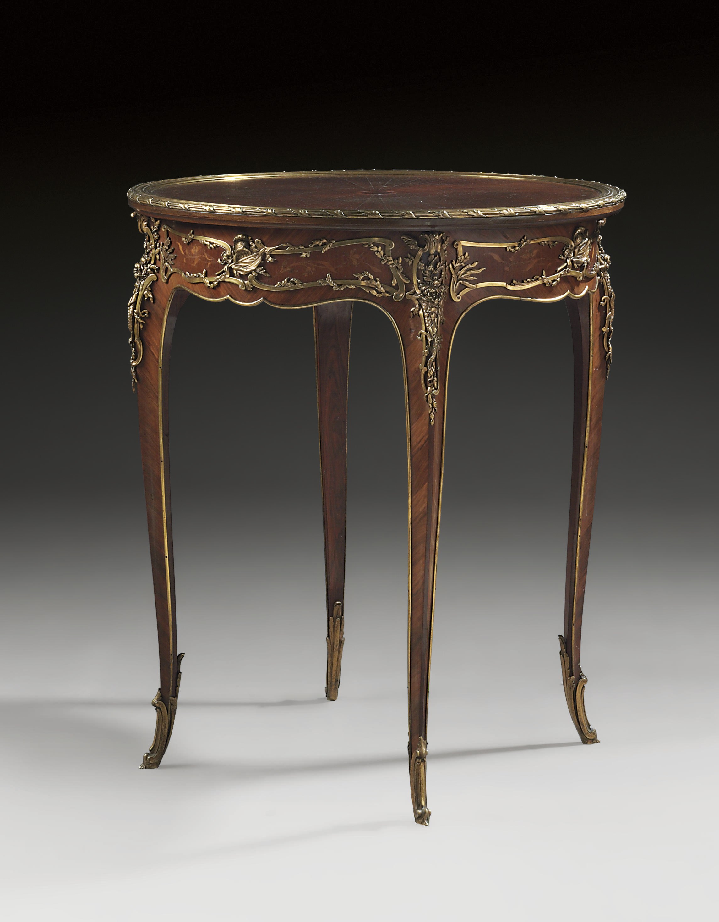 A FRENCH ORMOLU-MOUNTED TULIPWOOD PARQUETRY AND MARQUETRY OCCASIONAL TABLE
