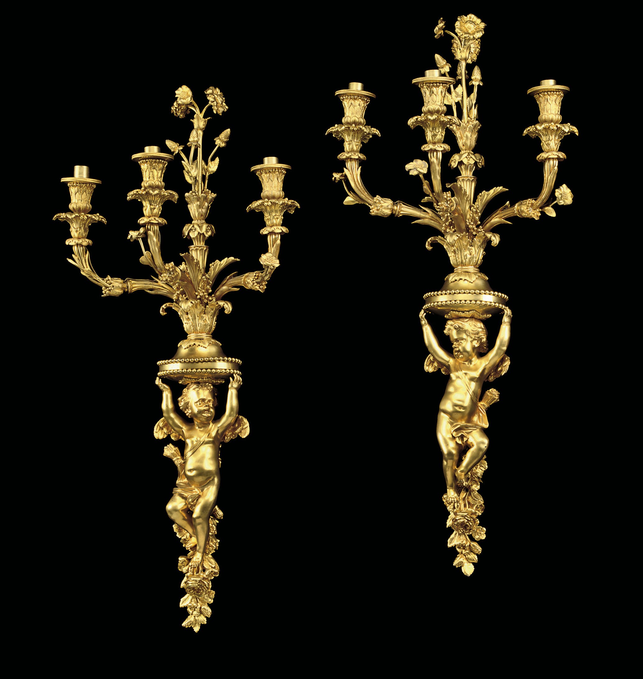A PAIR OF FRENCH ORMOLU THREE-LIGHT WALL-APPLIQUES