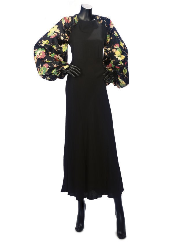 A VINTAGE BLACK CREPE EVENING GOWN